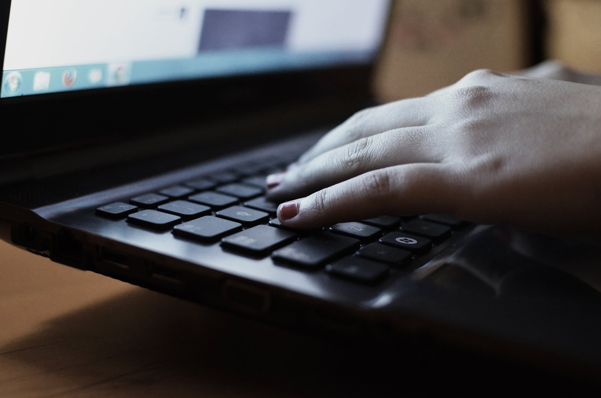 Person Using the Black Laptop Computer